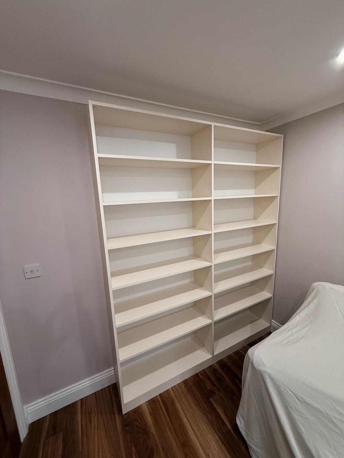 White freestanding bookcase with adjustable shelves