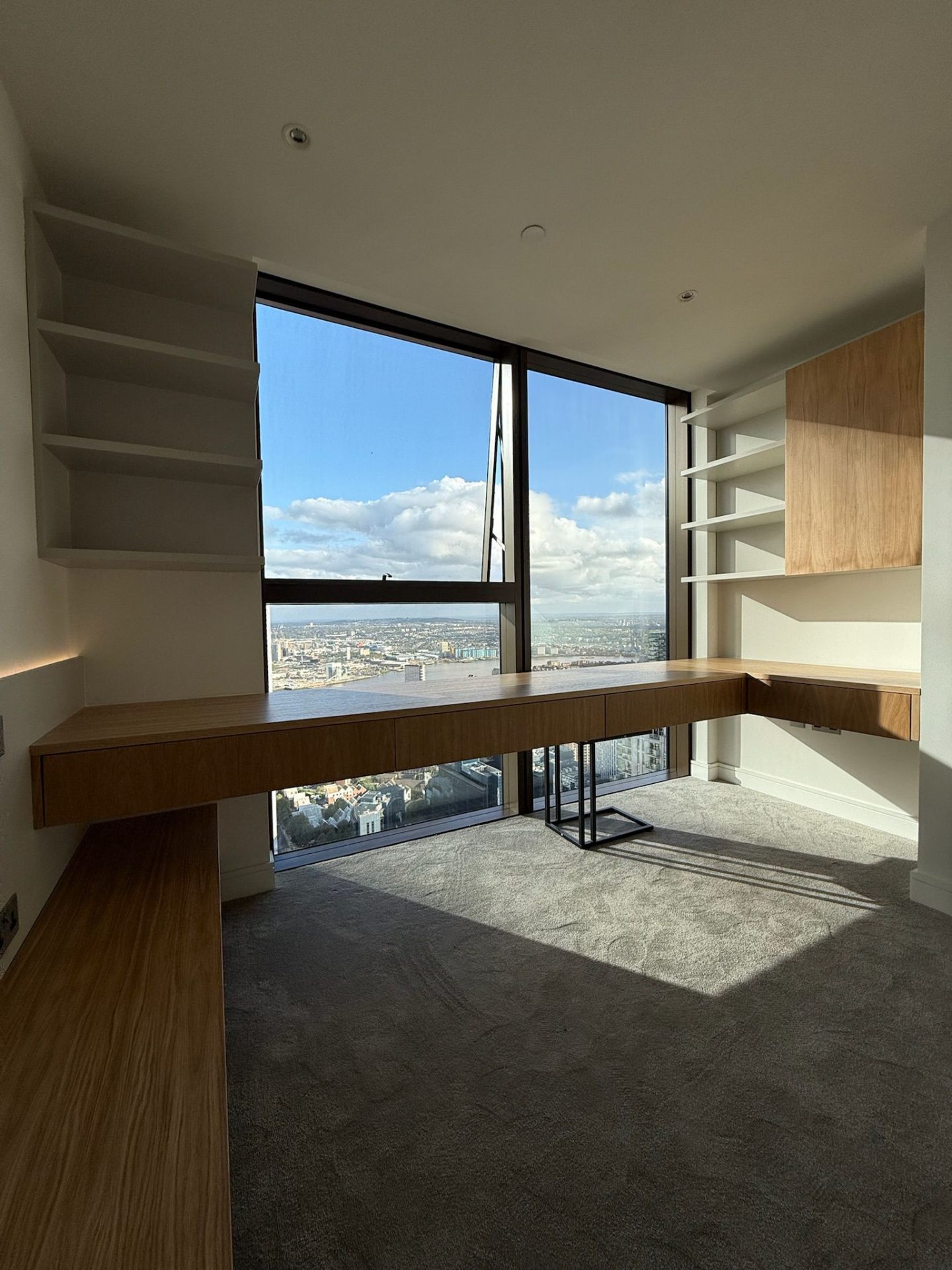 Home office desk with storage overlooking the city skyline